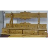 A Continental polished pine hanging spice rack, with 6 drawers, L142cm