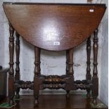 An oak oval gateleg table on baluster legs, W70cm