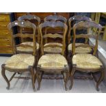 A set of 6 French oak ladder-back rush-seated dining chairs