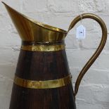 An Antique Continental brass-bound coopered oak jug, 62cm