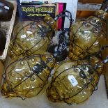 A set of 4 amber glass wirework encased lanterns, height 32cm overall