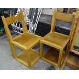 A pair of contemporary craftsman made oak hall chairs