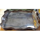 A large Victorian silver plate on copper serving tray, of serpentine form, with raised pierced