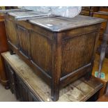 A 1920s panelled oak coffer, W108cm, H60cm