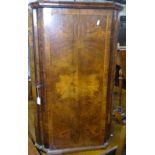 An 18th century figured walnut hanging corner cupboard, with ogee-shaped door, H94cm