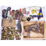 A box of military items, including buttons, medals, shrapnel etc