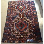 An Antique red ground Beluchi rug, 142cm x 89cm