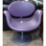 A Junior Tulip chair in purple leather on swivel base, by Pierre Poulin for Artiford