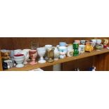 A shelf of Vintage wooden, porcelain, and glass egg cups