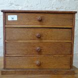 An oak table-top chest of 4 drawers, height 27.5cm