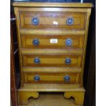 A reproduction yew wood small chest of 4 short drawers, W42cm, H61cm