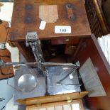 A mahogany-cased student's microscope, an Avery balance scale, and a box of slides