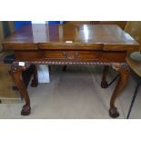 A good quality reproduction hardwood games table, single frieze drawer, raised on carved cabriole