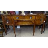 A George III cross-banded mahogany bow-front sideboard, with fitted drawers and cupboards, with