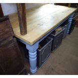 A rectangular polished and painted pine kitchen table, on baluster legs, L177cm, H78c, D90cm