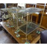 A gilt-metal 2-tier tea trolley, an oval 2-tier tea trolley, a gilt-metal nest of 3 glass-top