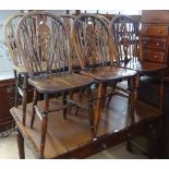 A set of 6 oak wheel-back dining chairs