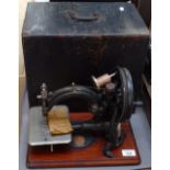 A Willcox & Gibbs early sewing machine, with wooden case