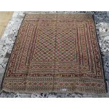 A needlework Sumak Kilim rug, 182cm x 132cm