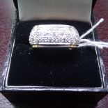A 9ct gold and diamond cluster panel ring