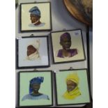 A set of 5 framed painted tiles, depicting Tribal figures, each 15.5cm