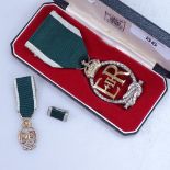 A cased 1983 Royal Mint medal and miniature