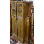 A Continental Art Deco walnut break-front cabinet, with 2 glazed panel doors, W110cm, H174cm