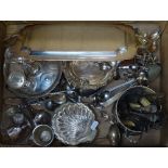 A box containing plated cutlery, an egg cup stand, a bottle holder etc