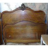 A French walnut 4'6" bedstead