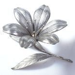 A silvered metal leaf design table centre