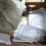 A box of various bed linen