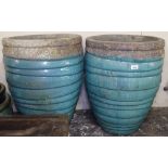 A pair of textured and turquoise glazed plant pots