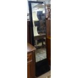 A modernist clear and black glass chevel mirror, H168cm