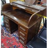 A 1930s oak twin-pedestal roll-top desk, W105cm, H100cm