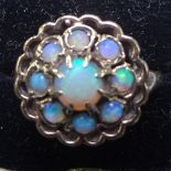 A 9ct gold daisy design opal set ring