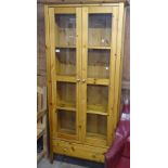 A modern polished pine display cabinet, with 2 glazed doors, W82cm, H180cm