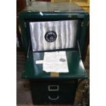 An unusual green painted metal 3-drawer filing cabinet, the top section having a fall-front