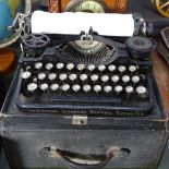 An early Underwood portable typewriter in case, and a box with carrying handle