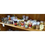 A shelf of Vintage metal, porcelain, plastic, and wooden egg cups