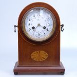 An Edwardian mantel clock with inlaid decoration, brass handles, and 2-train movement, height 28.5cm