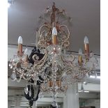 A scrolled metal and glass lustre 6-branch chandelier
