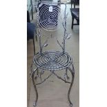 A craftsman made ornate wrought and polished steel side chair, with glass embellishments