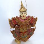 Southeast Asian carved and painted wood dressed puppet, height 38cm