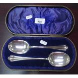 A modern pair of silver tablespoons in fitted box