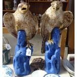 A pair of Continental glazed pottery ceramic eagles, height 48cm, both A/F