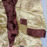 An Oriental embroidered silk gent's smoking jacket
