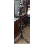 A Victorian scrolled wrought-iron telescopic oil lamp converted to electric