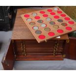 A mahogany table-top coin collector's chest, with drawer fitted interior, and contents, 29cm across