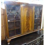 A 1930s mahogany 3-door bookcase, on cabriole feet, W136cm, H108cm