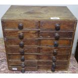 A Victorian pine 14-drawer collector's chest, with turned wood handles, W33cm, H30cm